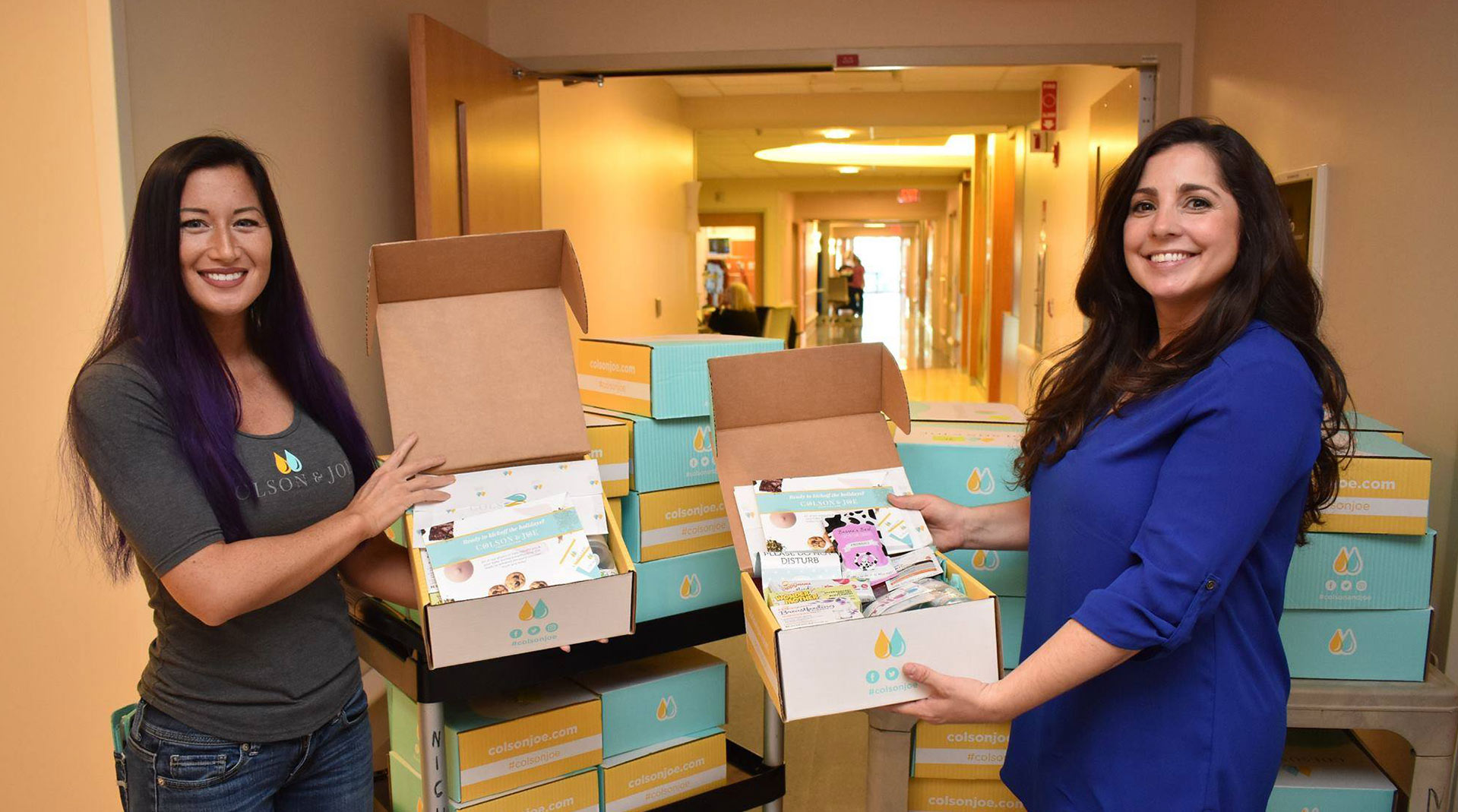 Naomi and Jessica giving away Colson & Joe subscription boxes in the NICU in Tampla, FL
