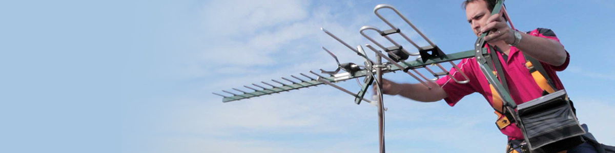 Installer fixing TV aerial that's not working