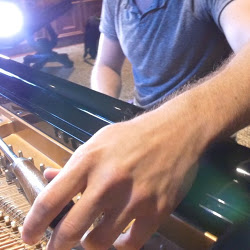 Kevin tuning a client piano.