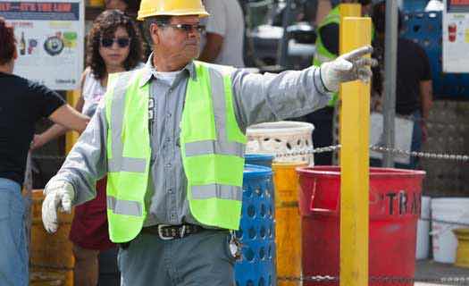 Worker Helping People Recycle
