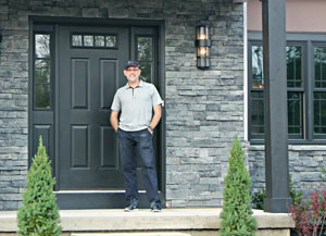 robert in front of home