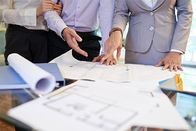 People looking at building plans