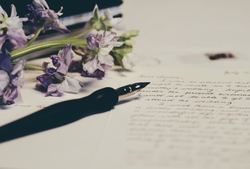 A letter in the making with fountain pen ready to share a message.