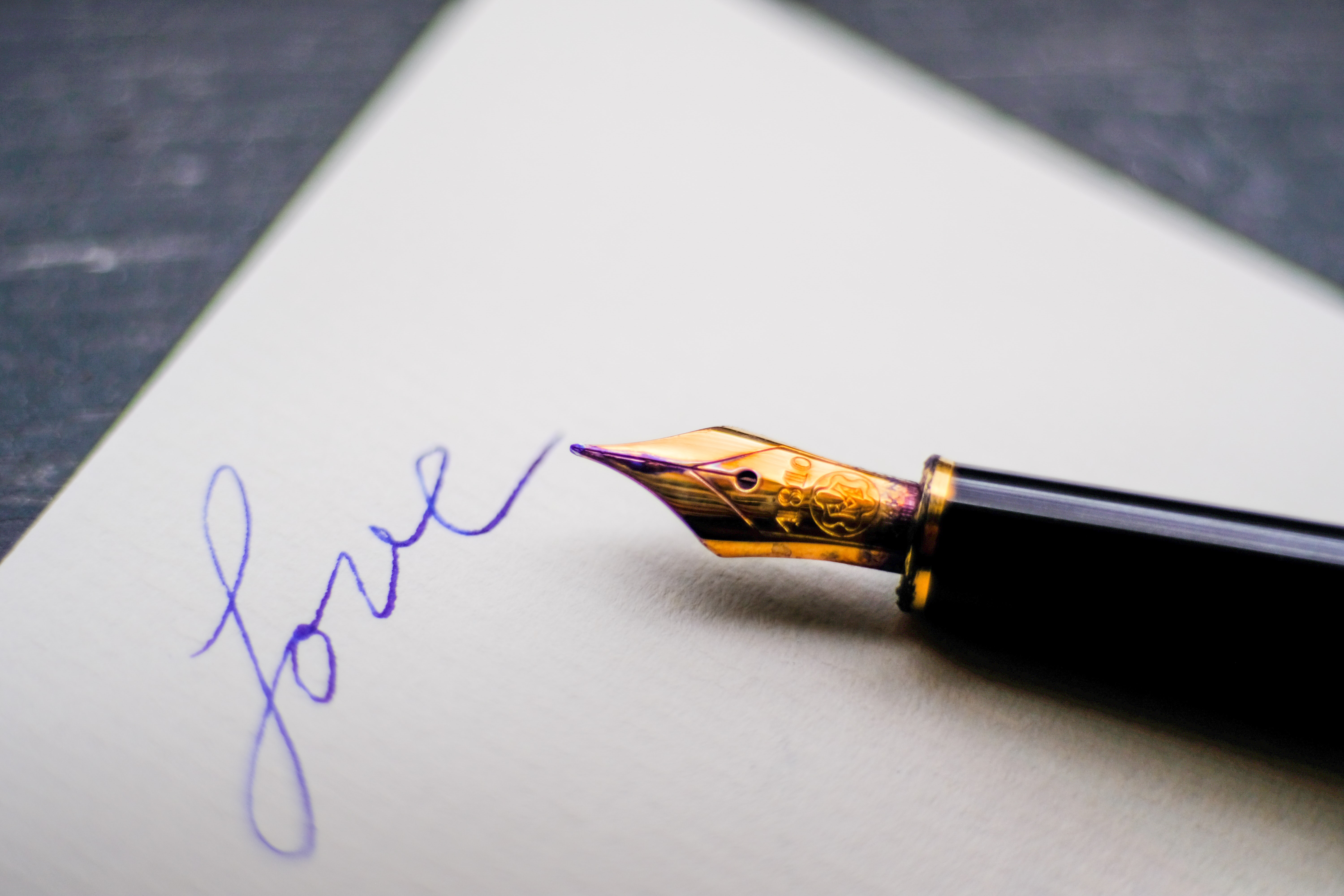 a fountain pen and paper ready to write a love letter.
