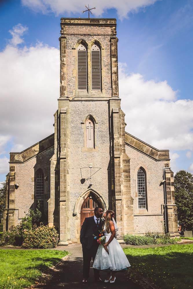 Bride and Groom in front of the church.