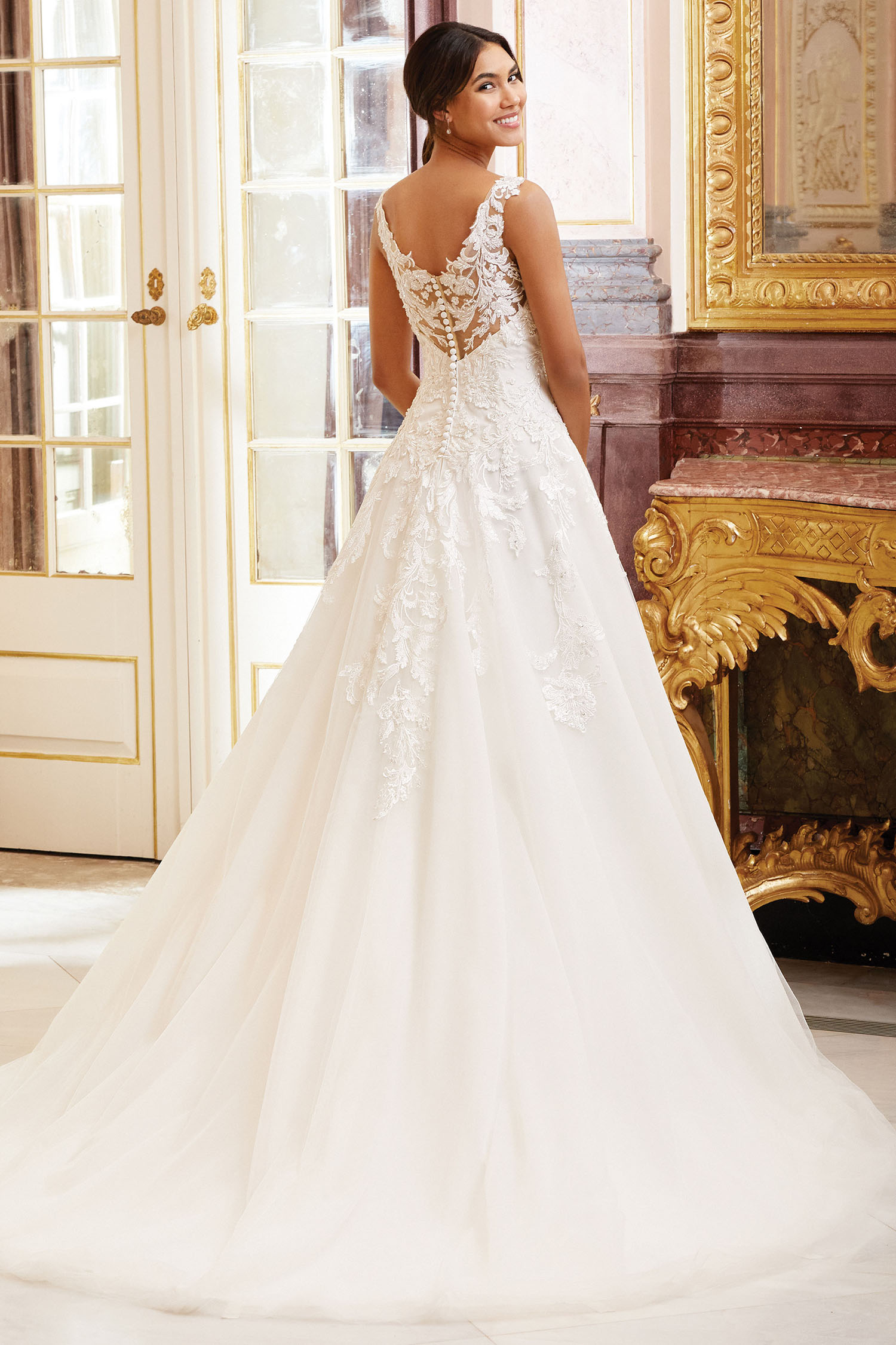 Bride wearing a princess style own with high llusion back.