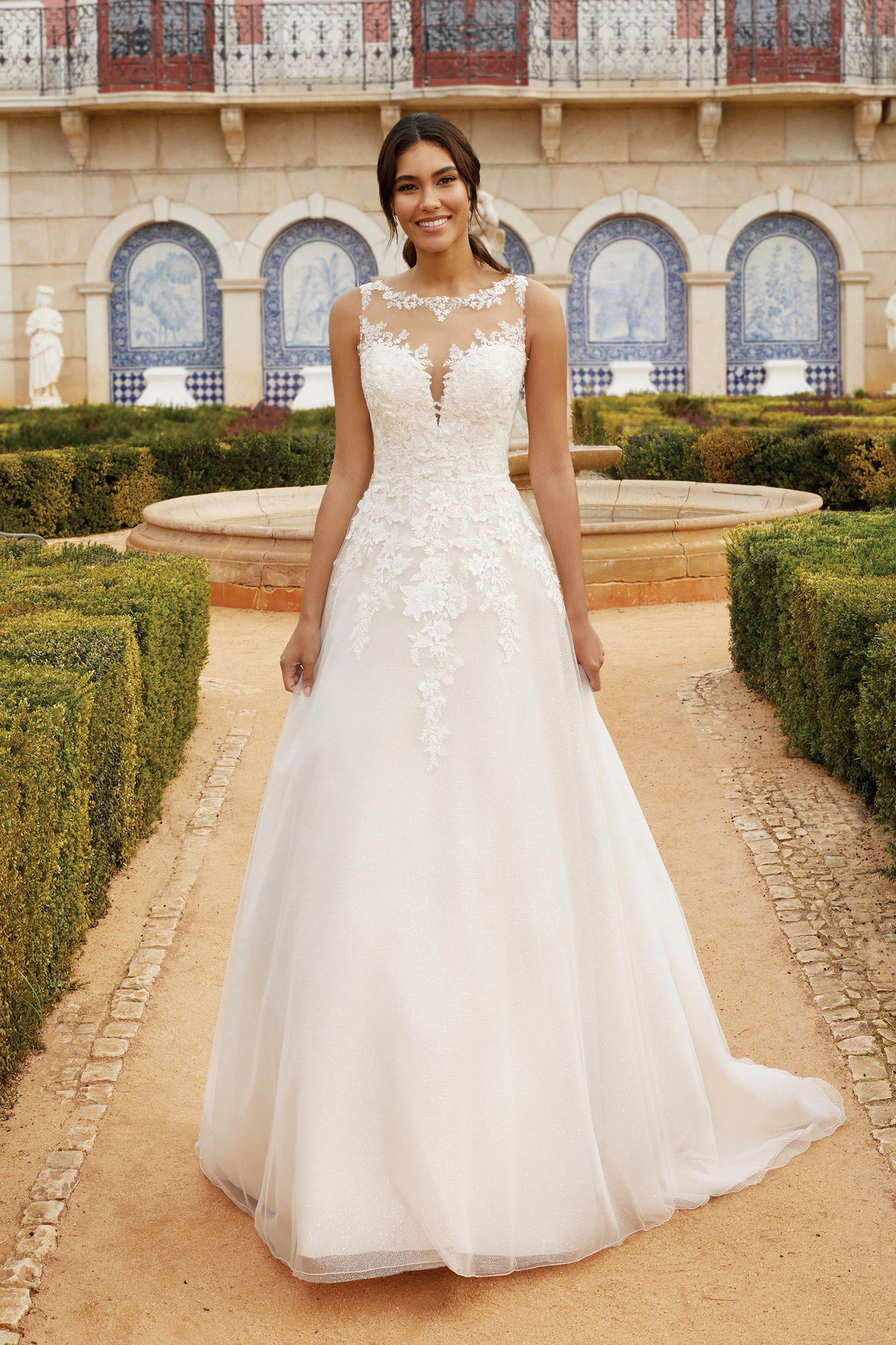 Bride wearing a simple A line gown with Sabrina illusion neckline