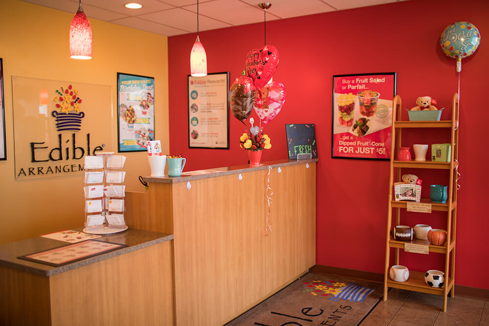 If you’re wanting a piece of chocolate dipped fruit as a snack or a quick gift, the Edible Arrangements staff can accommodate such requests. (Photo: Valerie Grant)