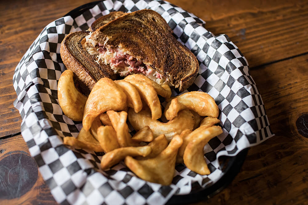 The Reuben is served on crispy toasted marble rye, filled with a generous serving of 100 percent certified Angus corned beef, sauerkraut, Swiss cheese, and Thousand Island dressing. (Photo: Valerie Grant)