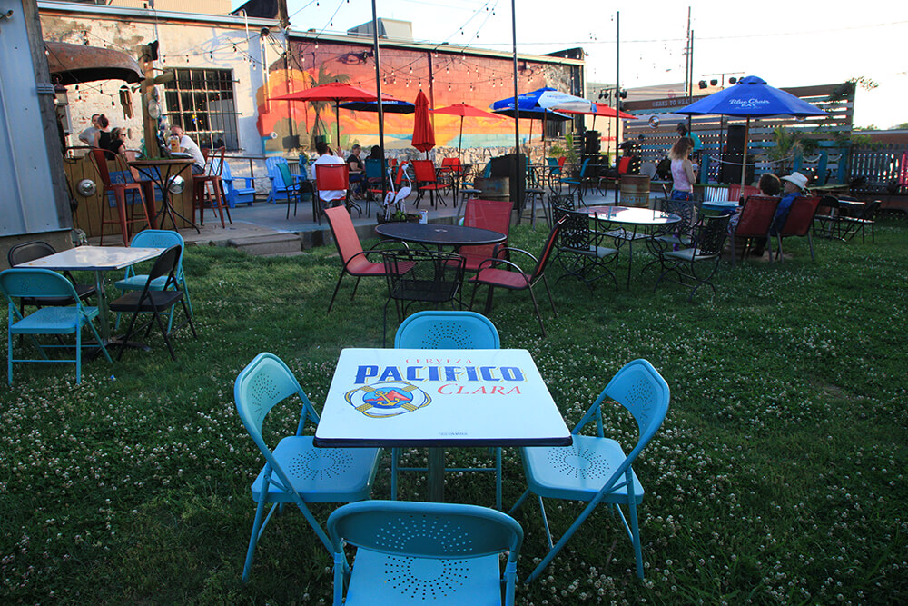 When you step through the back door of Soul City, you’ll find a spacious patio with ample seating, a low-key staging area and backyard space with lawn chairs and cornhole boards, completed with more eclectic decorations. (Photo: Marc Rains)