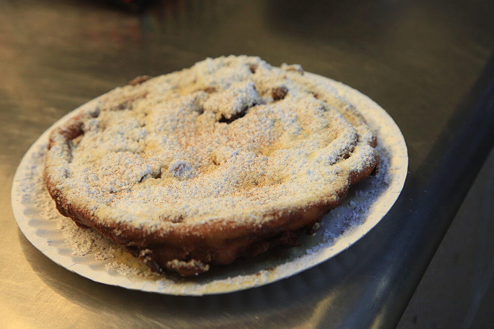 While many ballparks buy pre-made funnel cake mix, ONEOK Field makes its with whole milk from Oklahoma. (Photo: Marc Rains)
