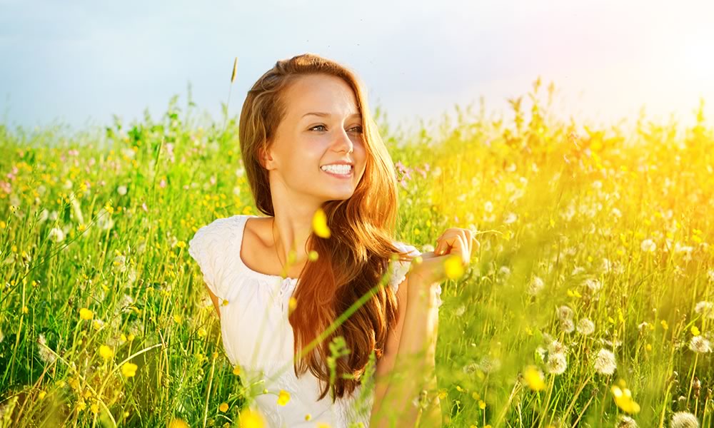 Woman smiling in grass