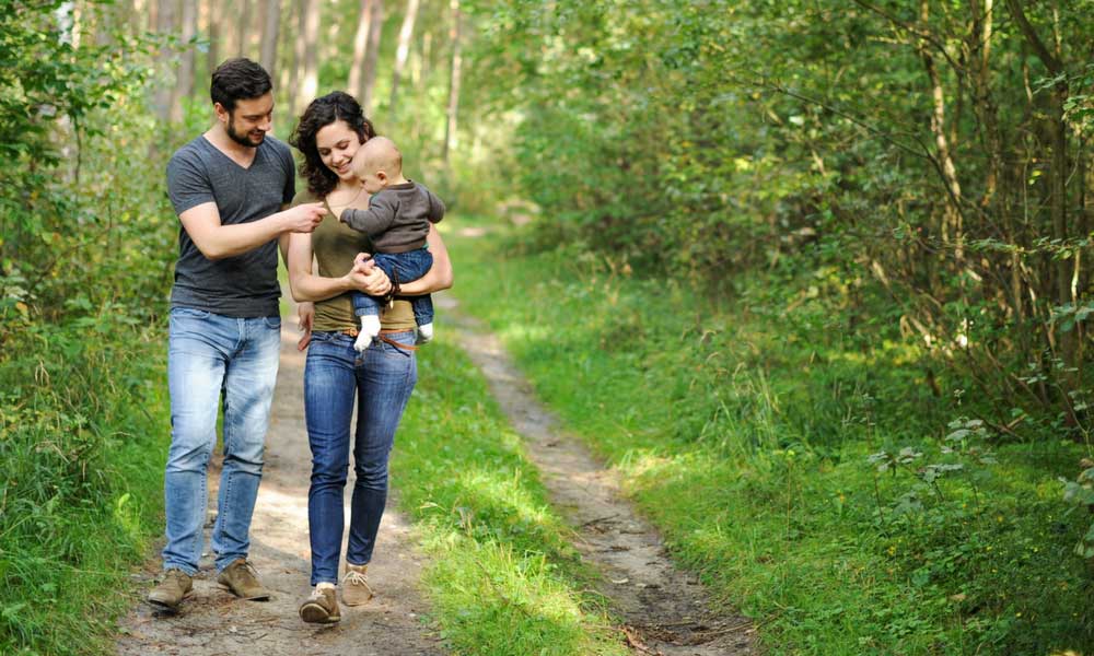 Family in the woods with child