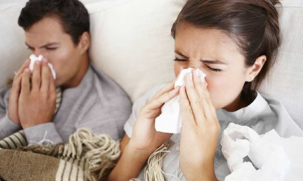 Couple sick in bed