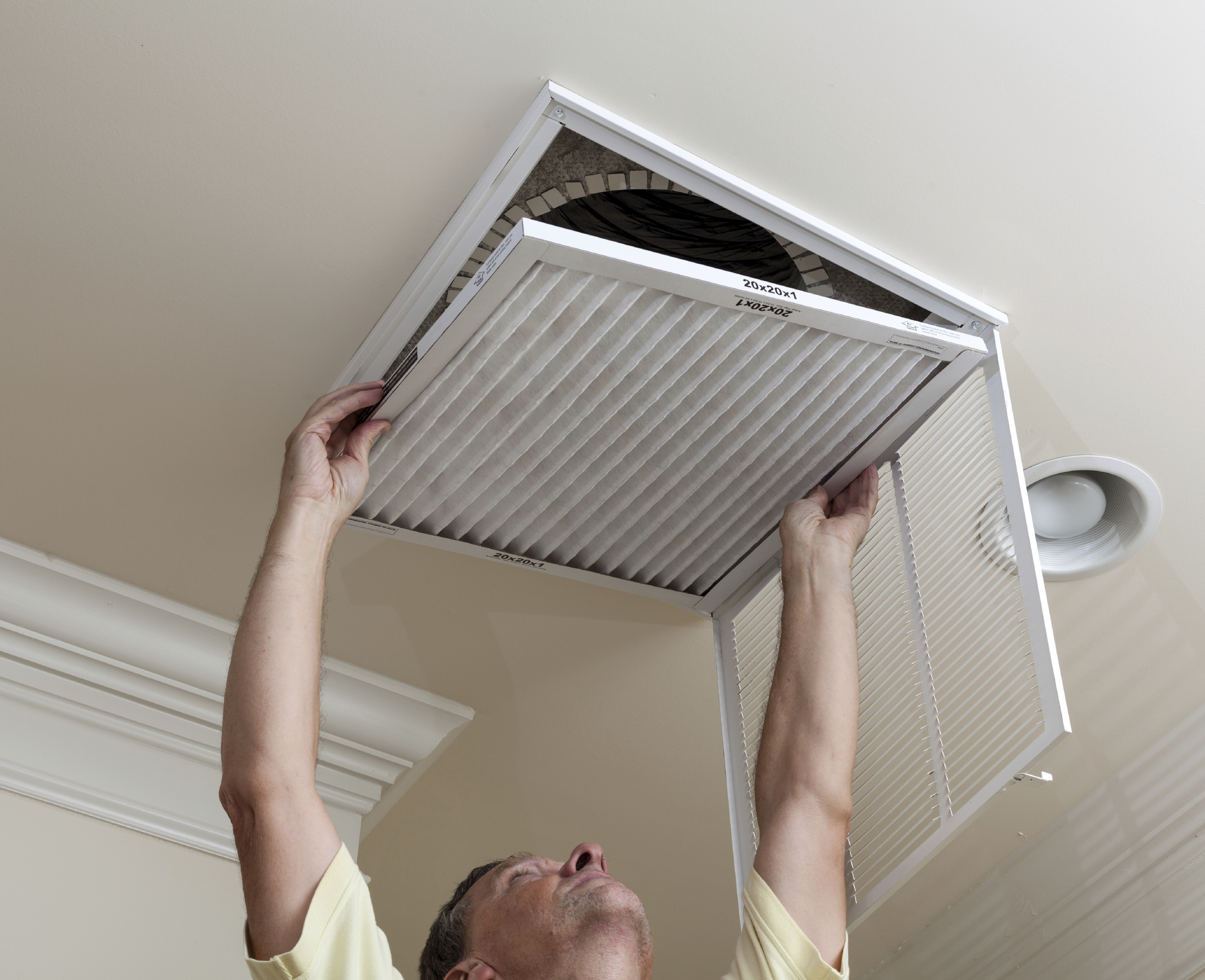 man changing air filter
