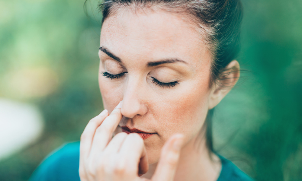 woman doing breathing exercises