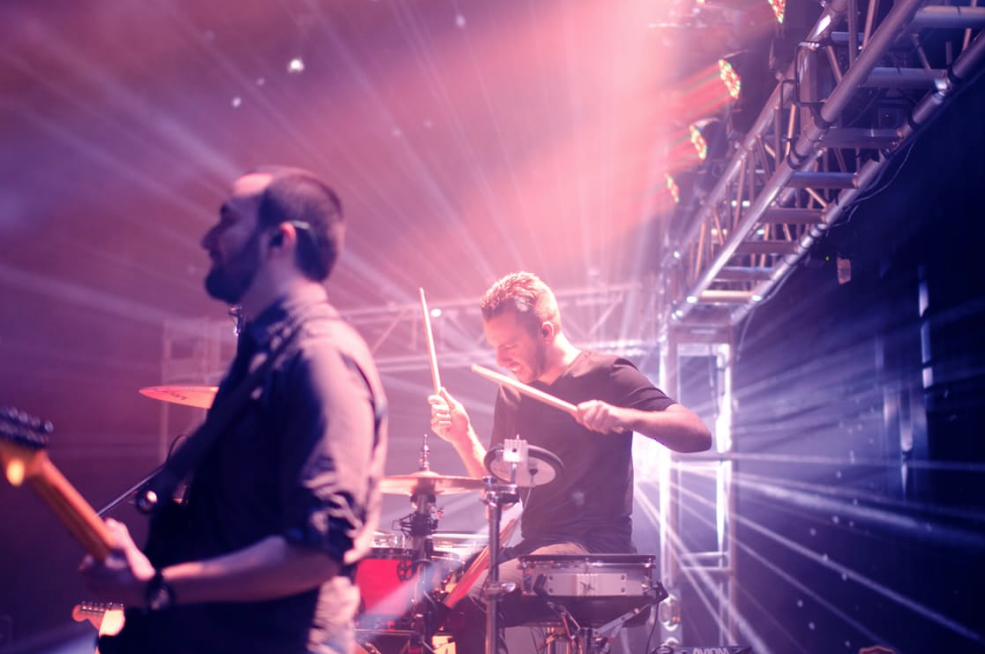 drummer and guitarist playing on stage