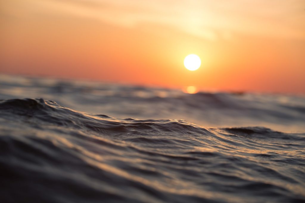 close-up of the ocean at sunset