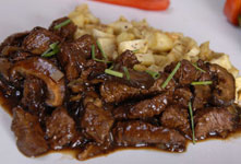 Glazed Beef Tips with Forest Mushrooms and Shallots on Sweet Potato Hash