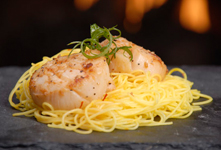 Pan-seared Diver Scallops with Garlic and White Wine on Nested Saffron Rice Noodles