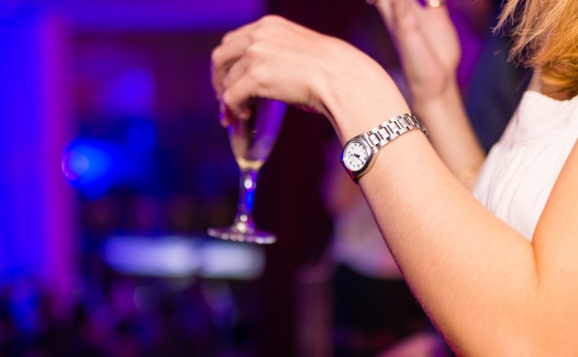 close-up of woman holding a glass of wine