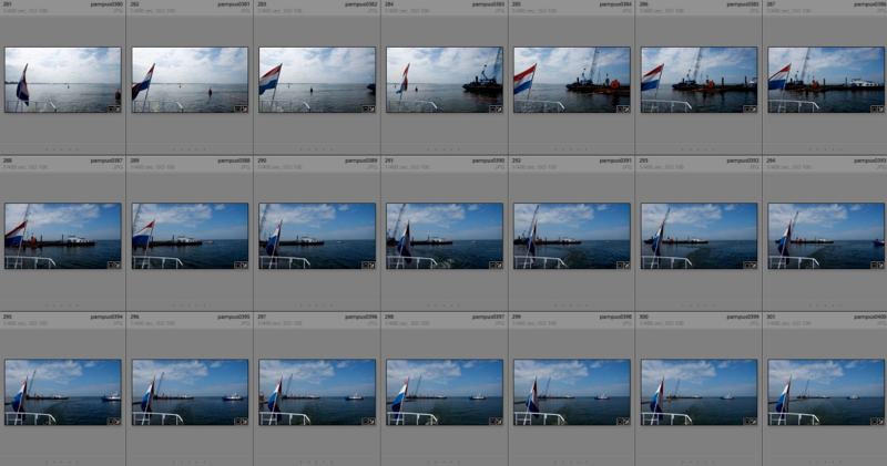 foto van foto's in Lightroom geladen van Nederlandse vlag op boot in water