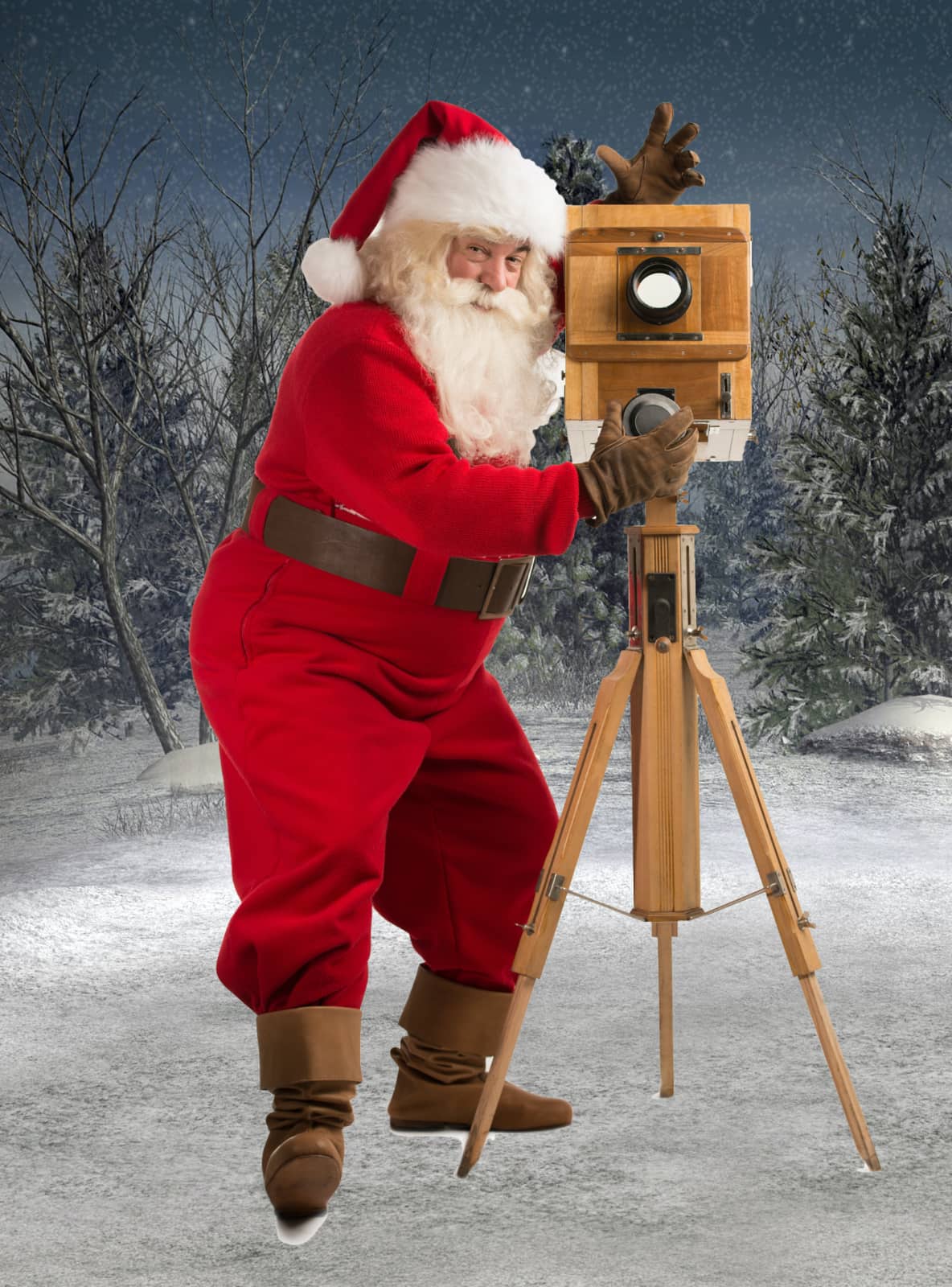 grappige kerstman met oude camera