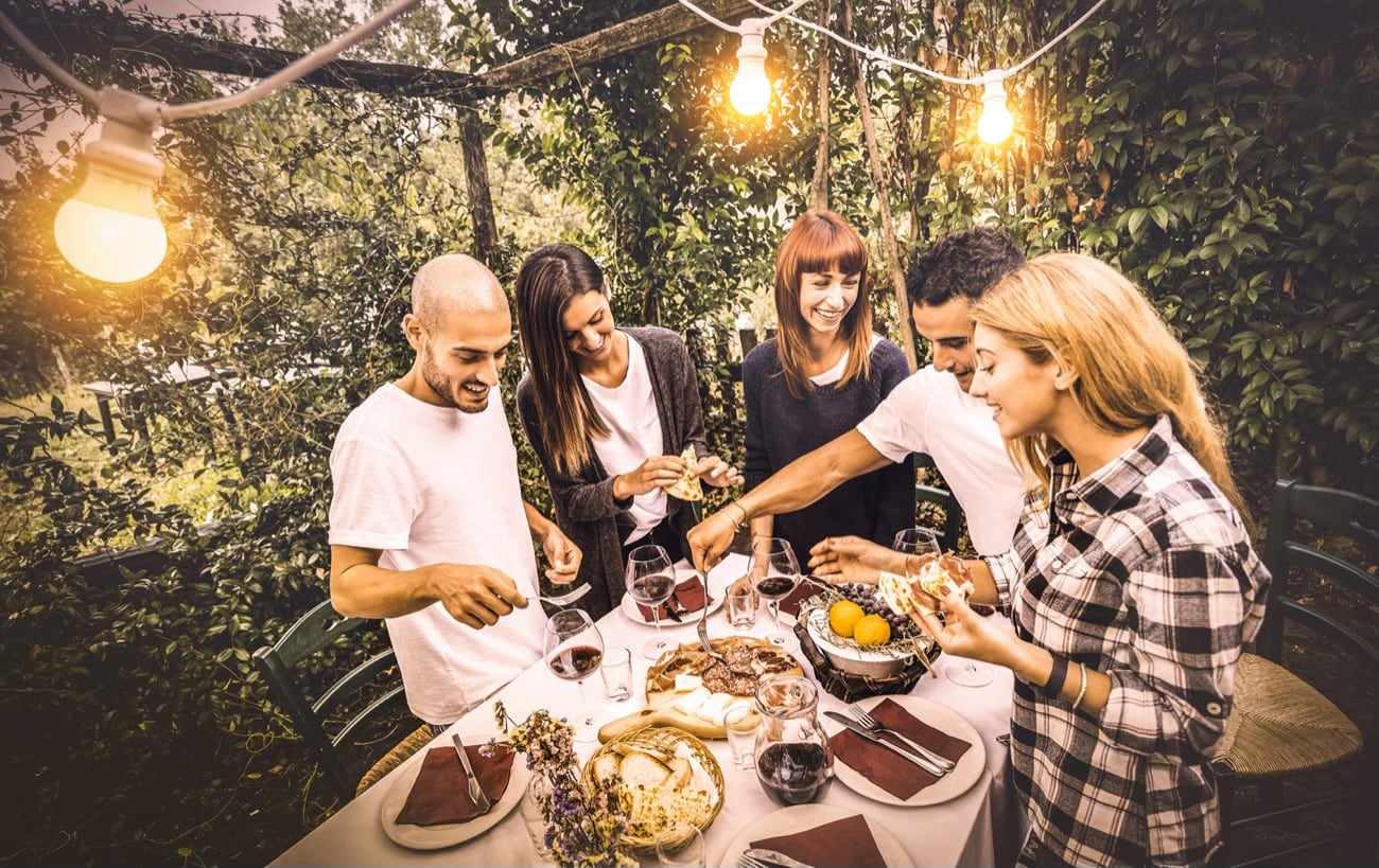 happy-friends-having-fun-eating-local-food-garden-fest