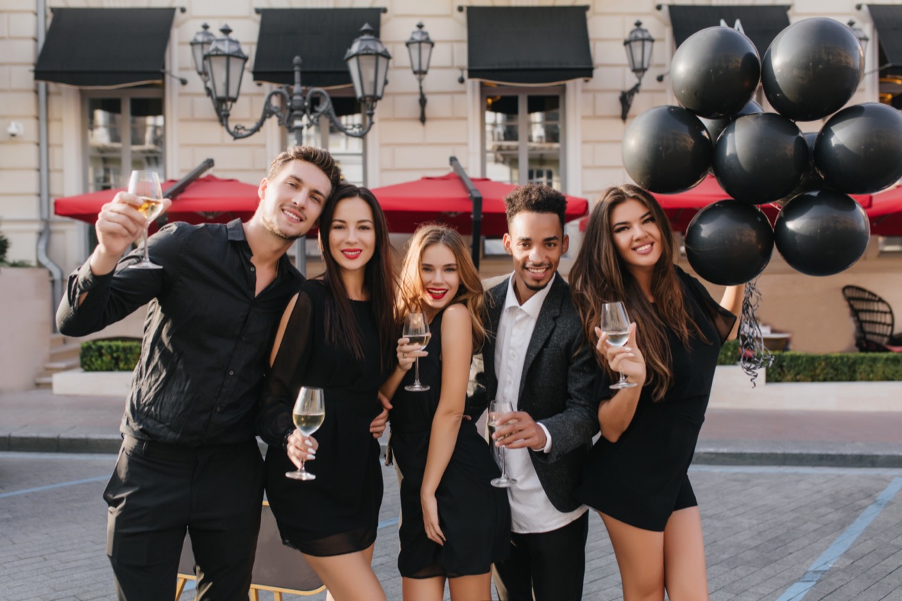 cheerful-friends-drinking-champagne-party-outdoors
