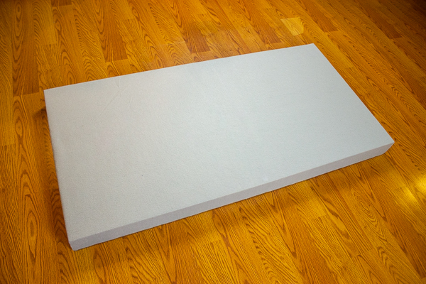 An image of the front side of an acoustic panel wrapped in felt.