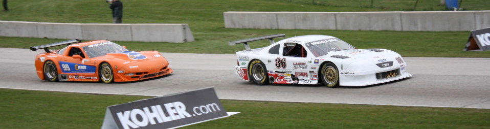 two cars competing during a race