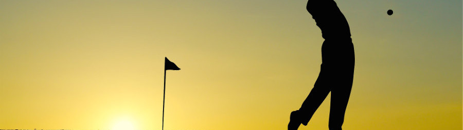 silhouette of someone swinging a golf club