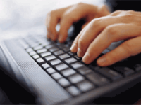 person typing on a laptop