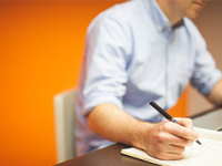 person taking notes on AdWords