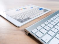 tablet and computer keyboard on google homepage