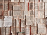 a bunch of books with pages open