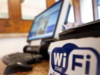 computer next to wifi logo