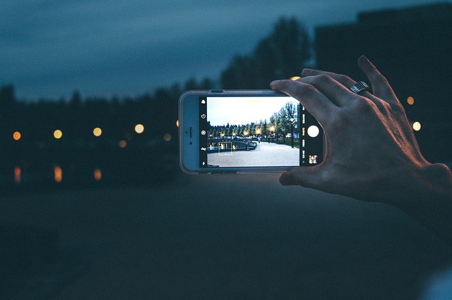 person taking a panoramic picture on their phone