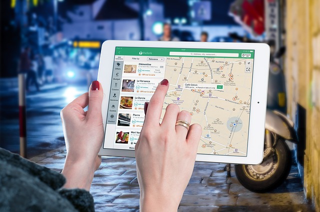 woman checking google maps on her tablet
