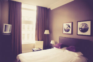 white sheets on a bed in a hotel room