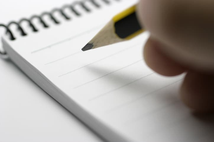 writing down marketing notes