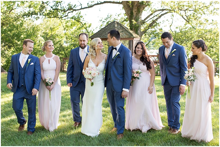 A wedding party poses for a picture at great oak manor in md