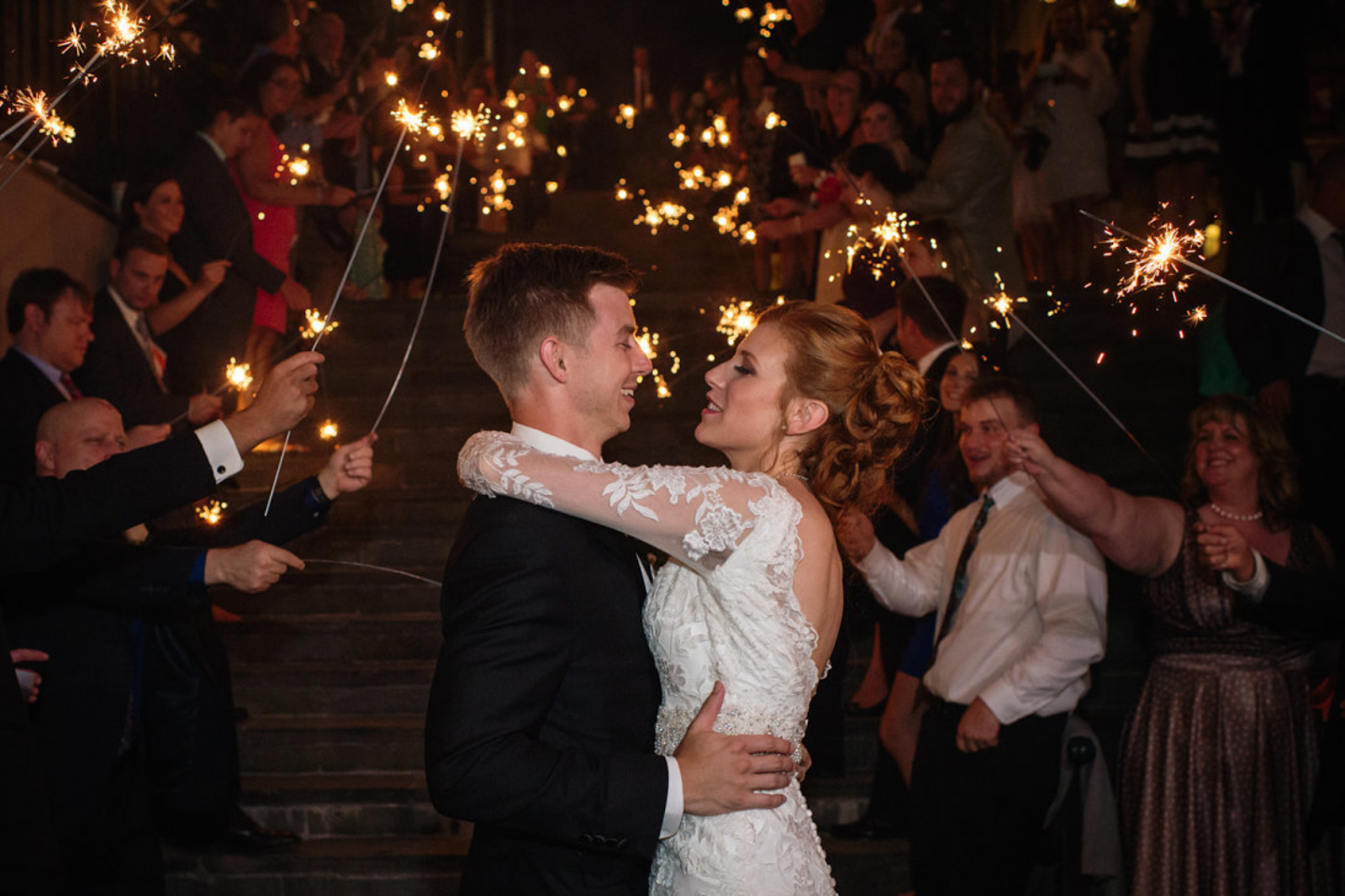 wedding couple in front of sparklers