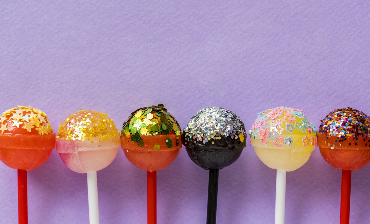 row of decorated lollipops