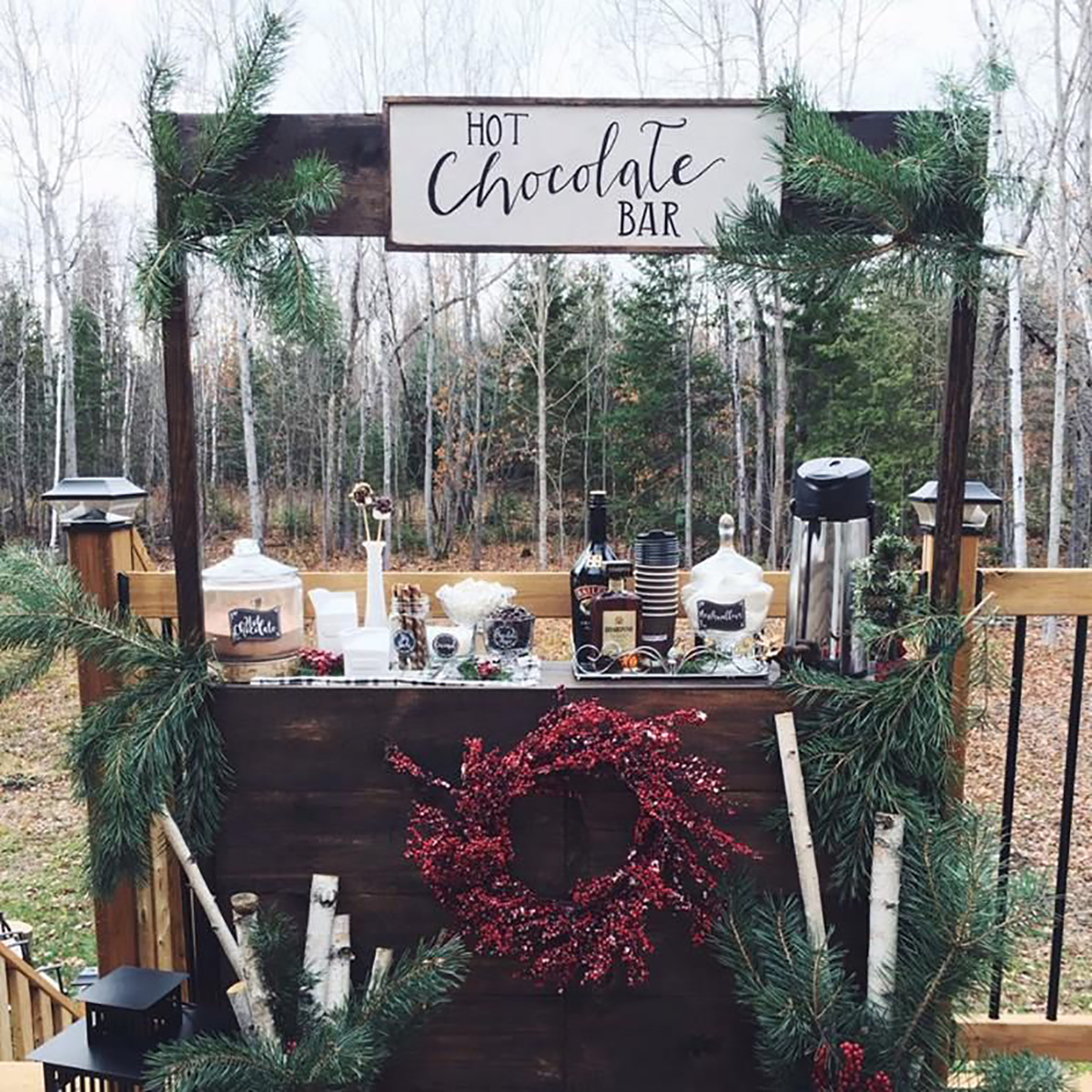 outdoor hot chocolate bar with wreath