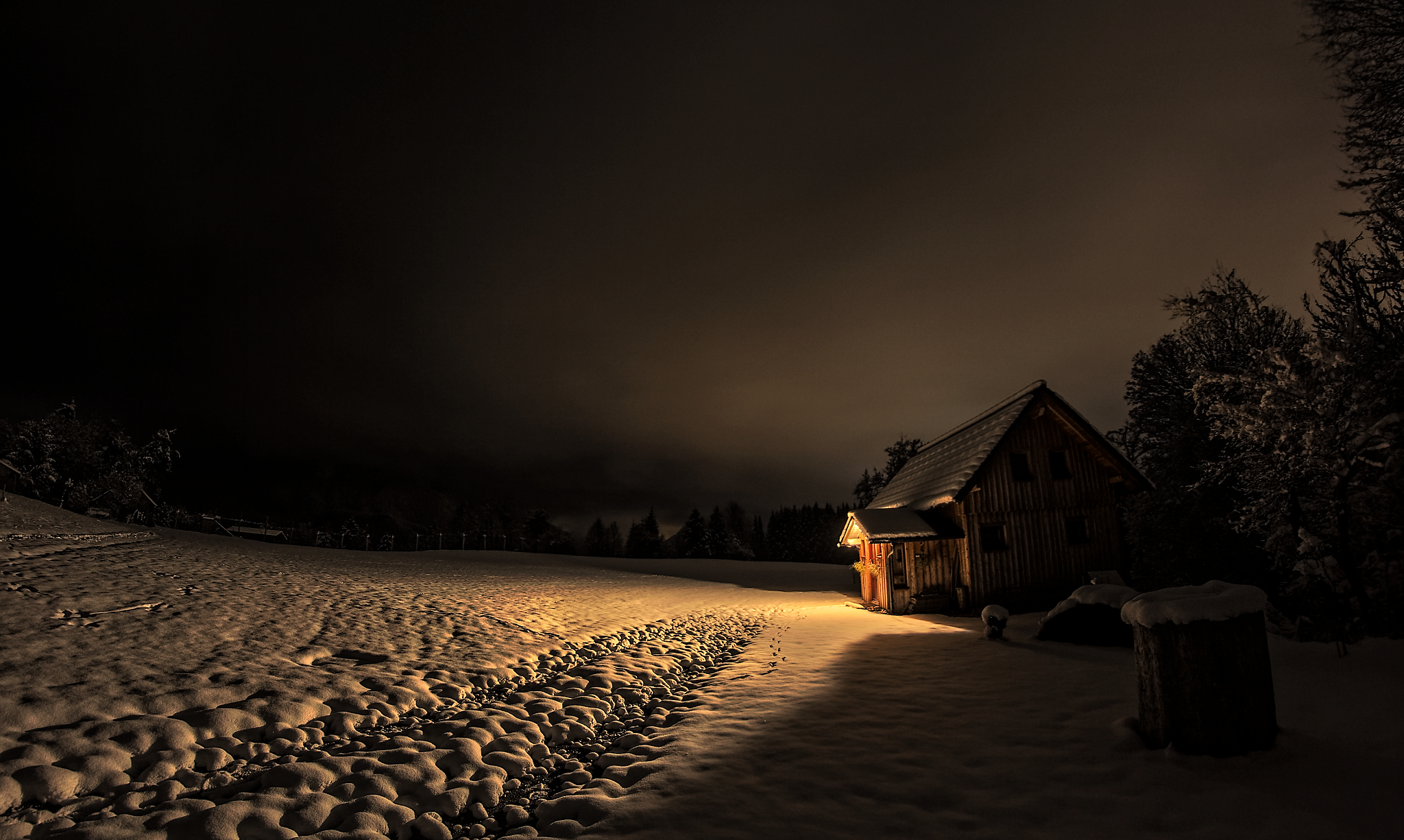 hut in the alps covered in snow