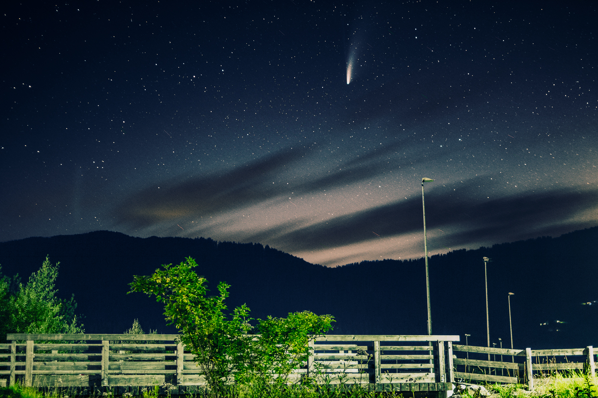 Comet Neowise with a wooden bridge in the forground