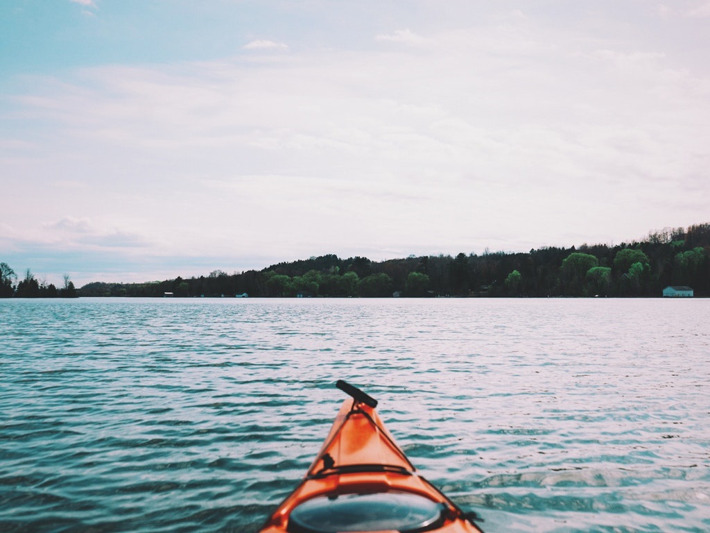 a kayaker on a lake