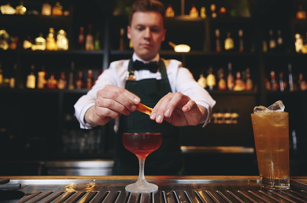 bartender preparing a mixed drink