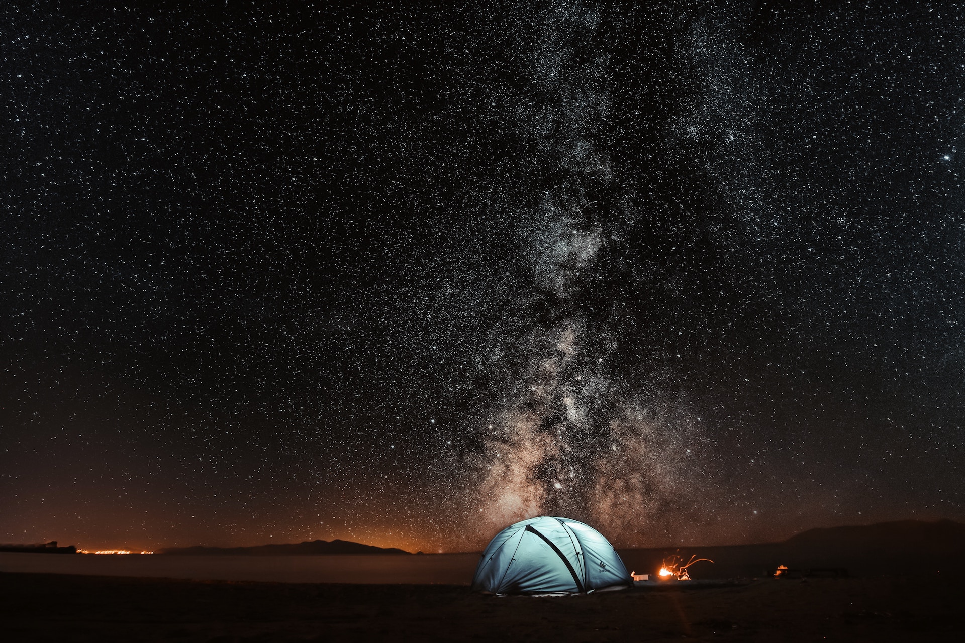 tent under star filled night sky
